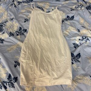 White tight fitting mini dress with spaghetti straps